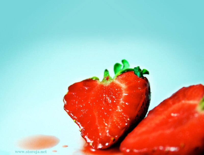 sliced strawberry on blue
