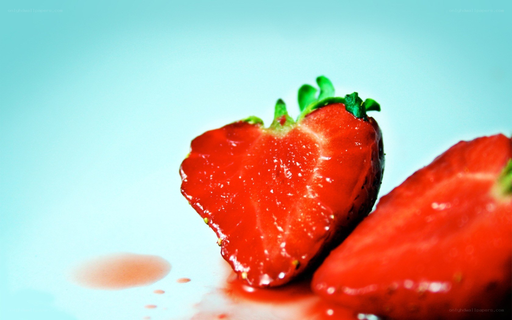 sliced strawberry on blue