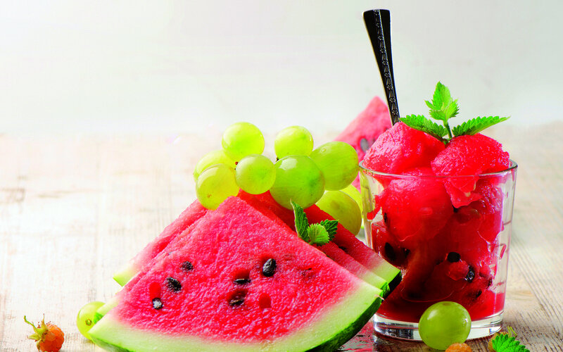 Sliced Watermelon and Grapes