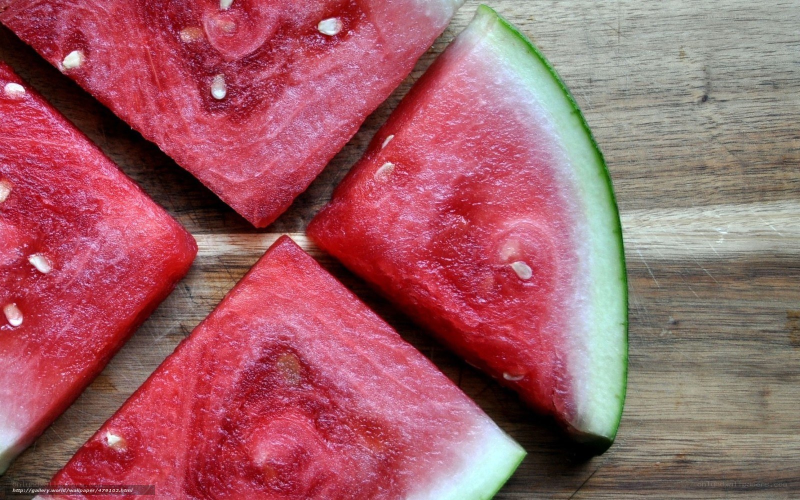 sliced watermelon on wood