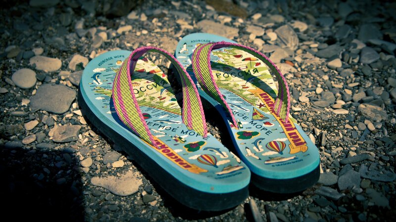 Slippers on a pebble beach