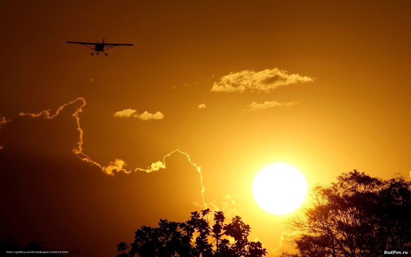 Small Airplane at Sunset — Orange, Dramatic