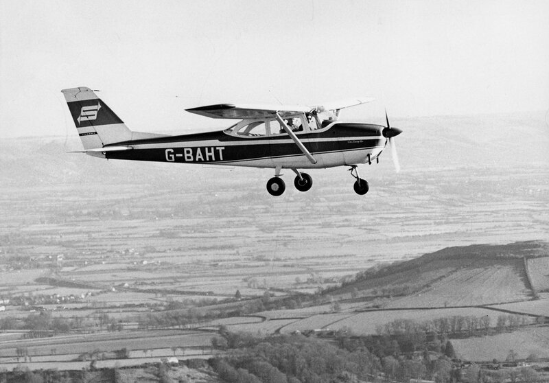 Small Airplane in Flight — Black, Calm