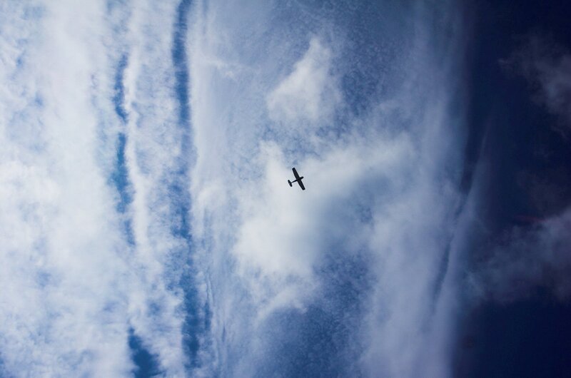 Small Airplane in Sky — Blue