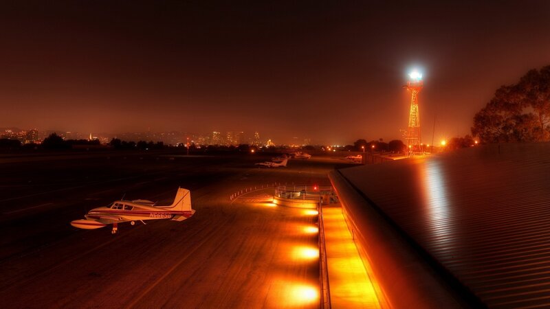 Small Airplane on Tarmac — Orange, Dramatic
