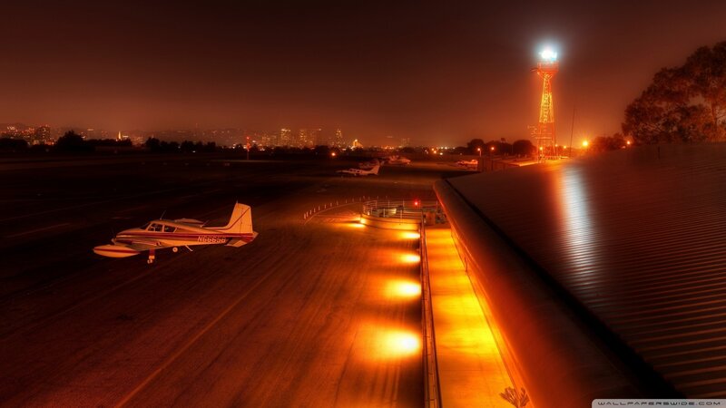 Small Airplane on Tarmac — Orange