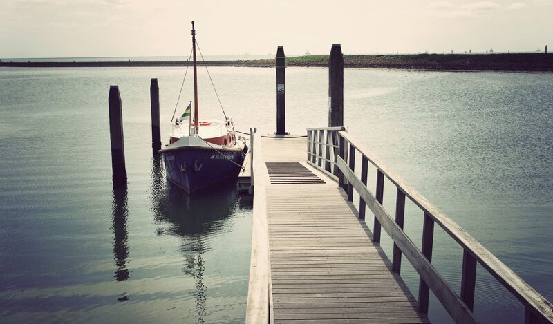 Small Boat at Dock — Blue, Calm, Afternoon