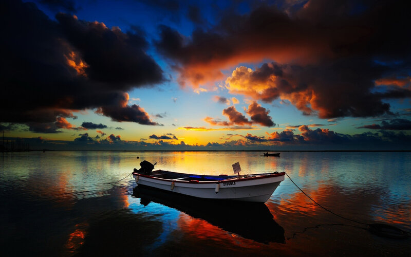Small Boat at Sunset — Blue, Dramatic, Photograph, Clouds