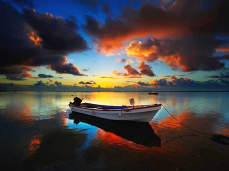 Small Boat at Sunset — Blue, Dramatic, Photograph, Sky, Water, Orange, Yellow