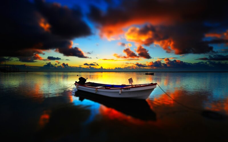 Small Boat at Sunset — Blue, Dramatic, Photograph, Sky, Water