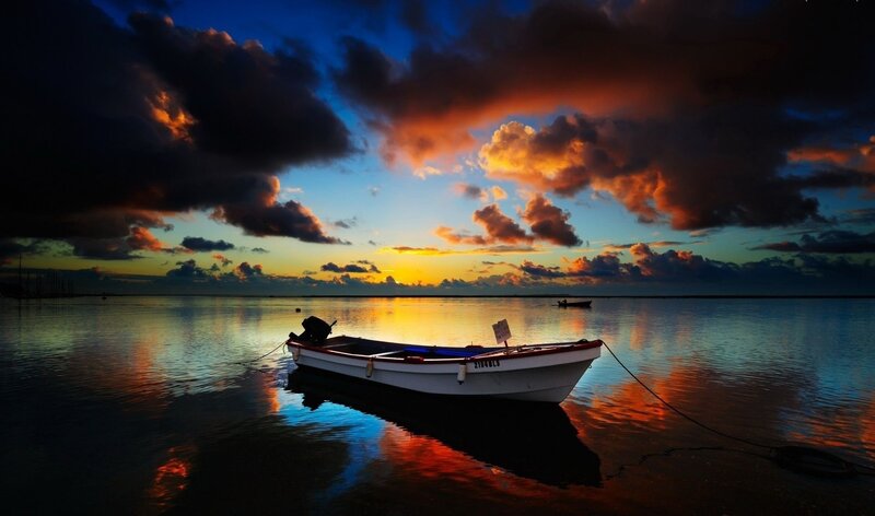 Small Boat at Sunset — Blue, Dramatic, Photograph