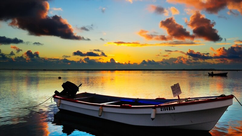Small Boat at Sunset — Blue, Serene, Photograph, Sky