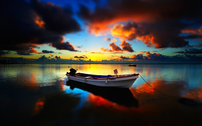 Small Boat at Sunset — Dramatic