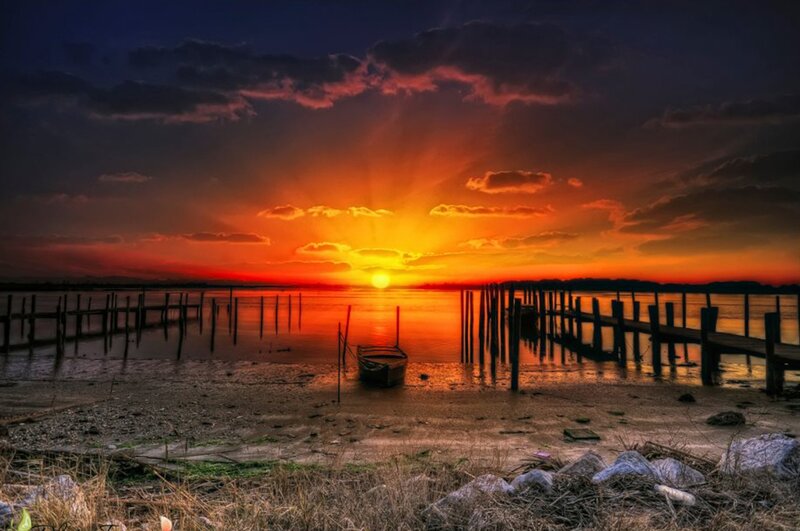 Small Boat at Sunset — Orange, Dramatic, Photograph