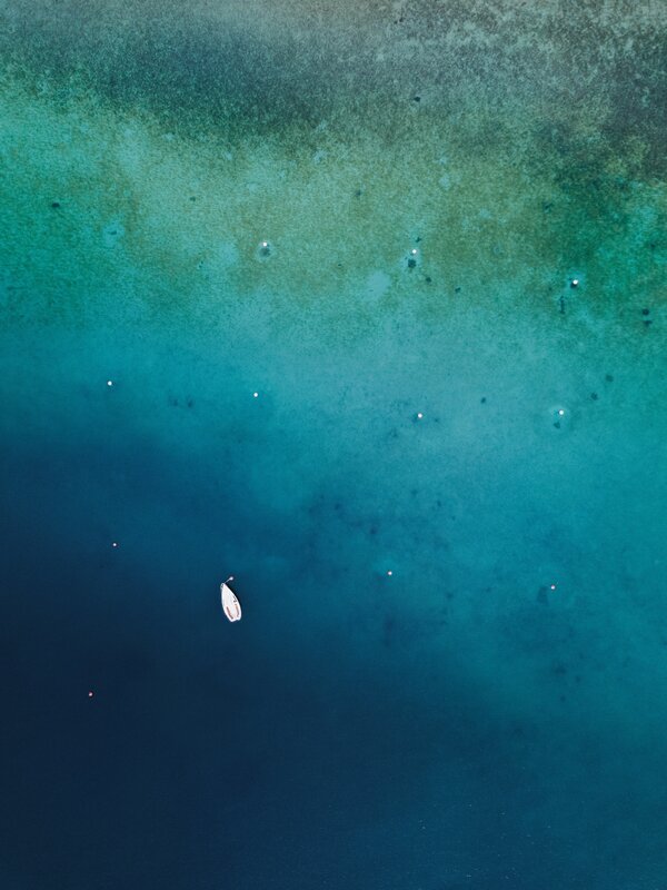 Small Boat in Blue Water