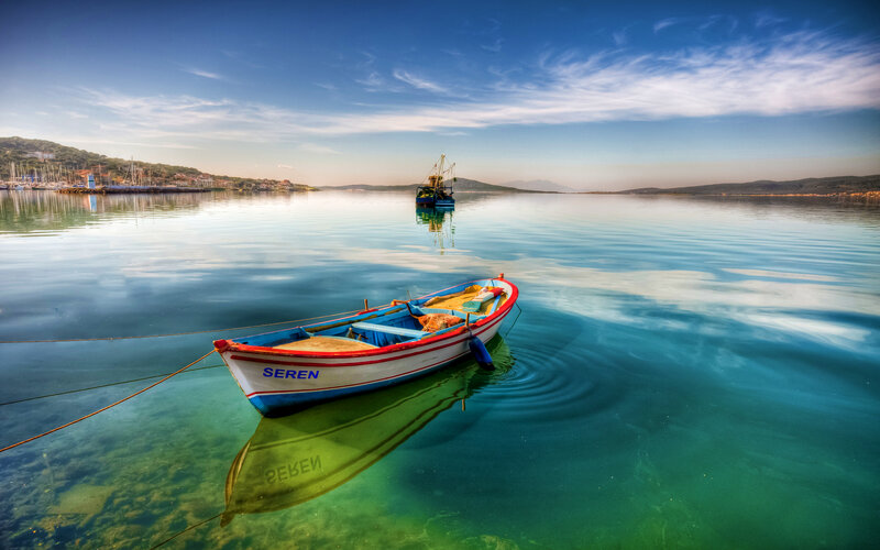 Small Boat in Calm Water — Blue