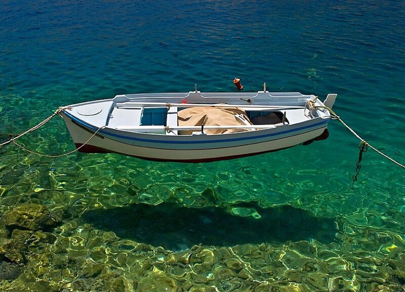 Small boat in clear water