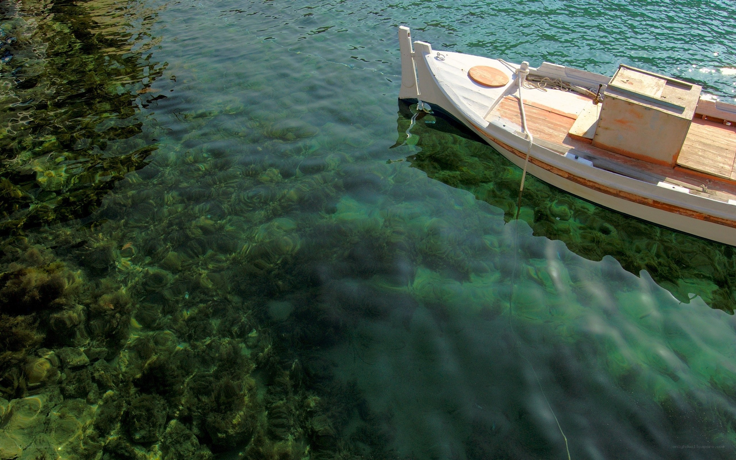Small boat in clear water
