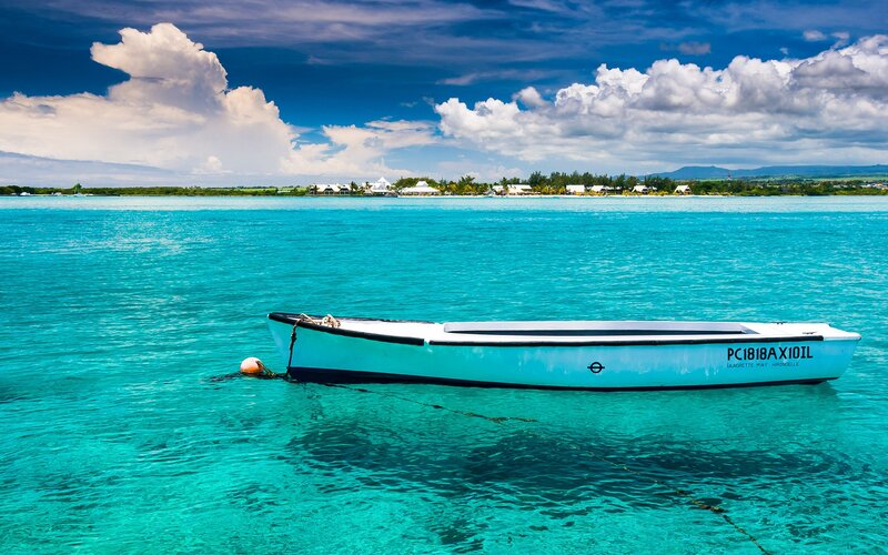 Small Boat in Turquoise Water — Blue, Serene, Afternoon, Photograph