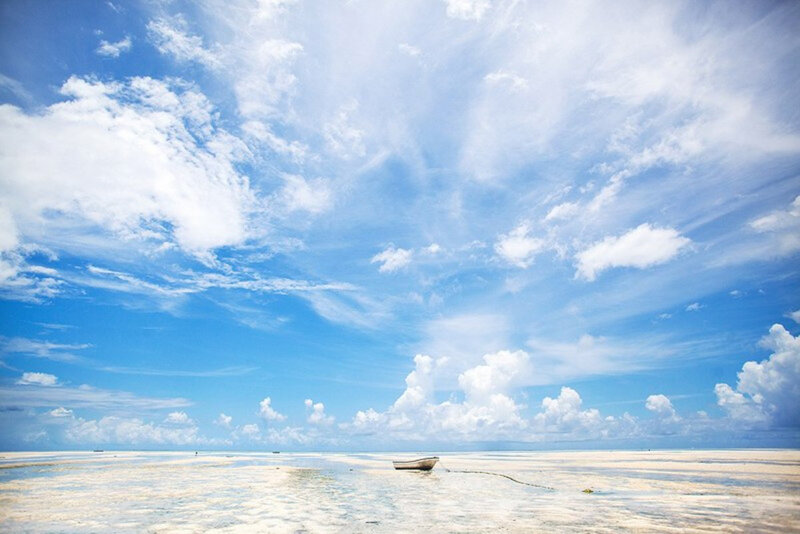 Small Boat on Beach — Blue, Serene, Afternoon, Photograph, Clouds
