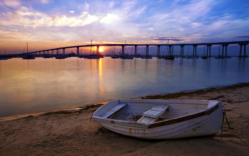 Small Boat on Beach — Blue, Serene, Sunset, Photograph, Bridge