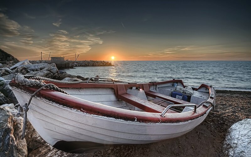 Small Boat on Beach — White, Serene, Sunset