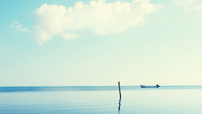 Small Boat on Calm Water — Blue, Serene, Afternoon