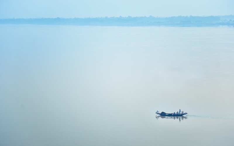 Small Boat on Calm Water — Blue, Serene, Morning, Photograph, People, River
