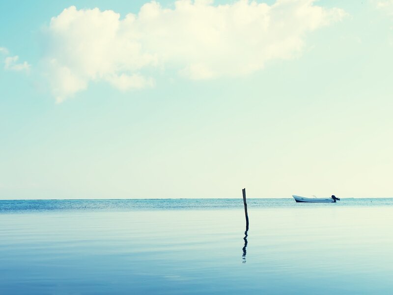 Small Boat on Calm Water — Blue, Serene, Morning, Photograph