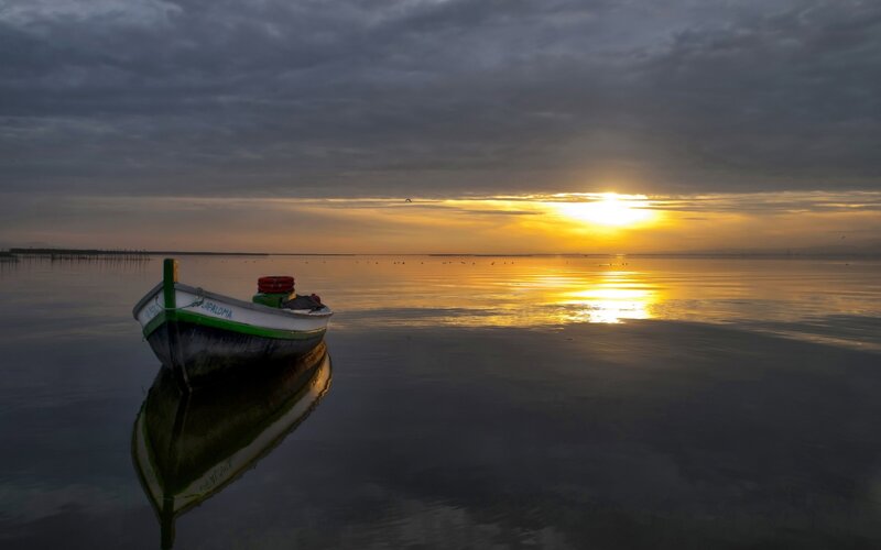 Small Boat on Calm Water — Yellow