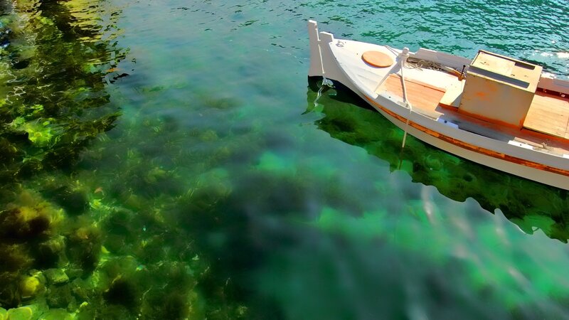 Small boat on clear water