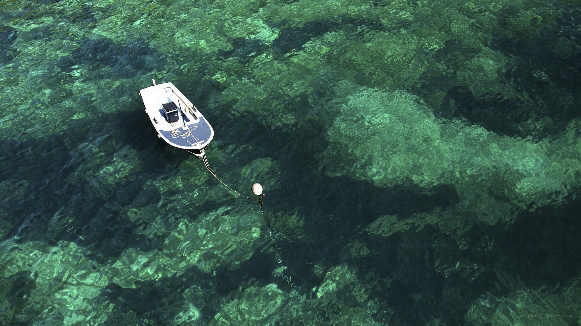 Small boat on clear water