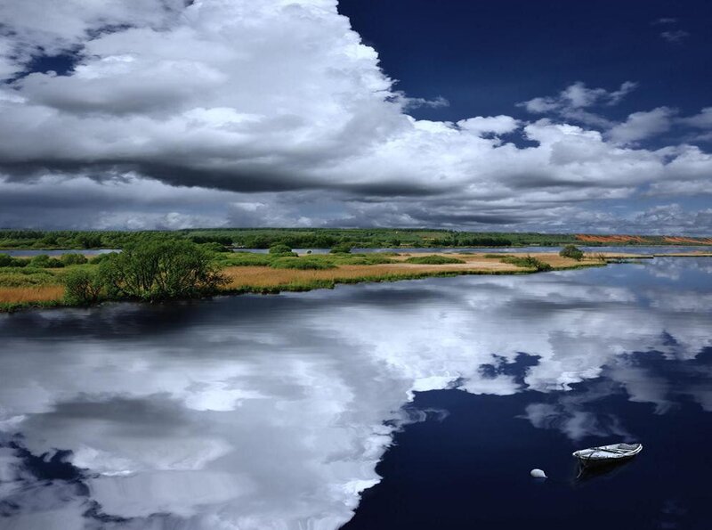 Small Boat on Lake — Blue, Dramatic