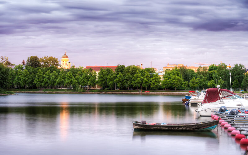 Small Boat on Lake — Green, Serene, Sunset
