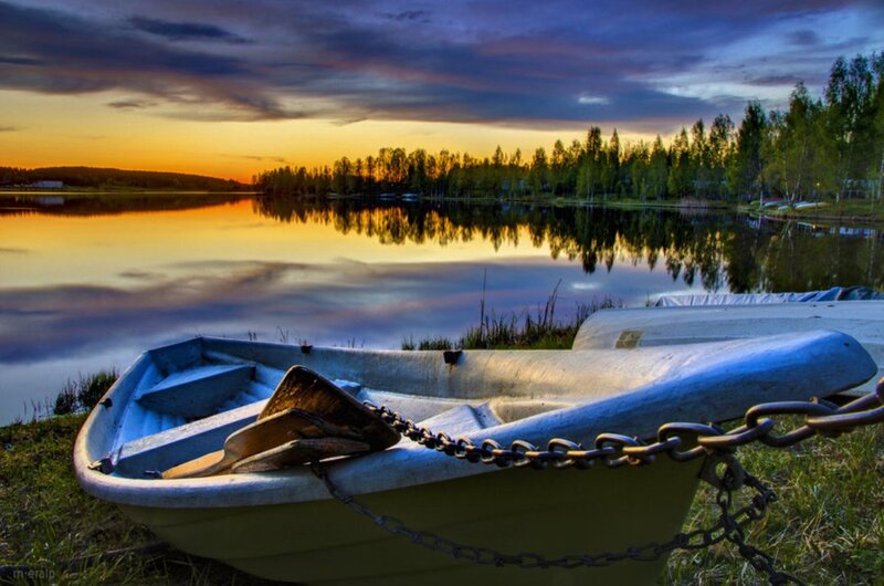 Small Boat on Lake Shore — Blue, Serene, Sunset