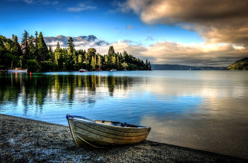 Small Boat on Lake Shore — Blue, Serene