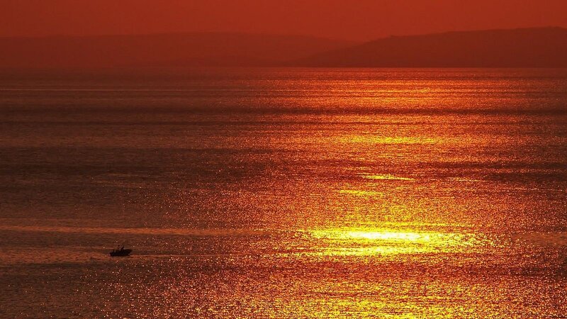 Small Boat on Ocean — Orange