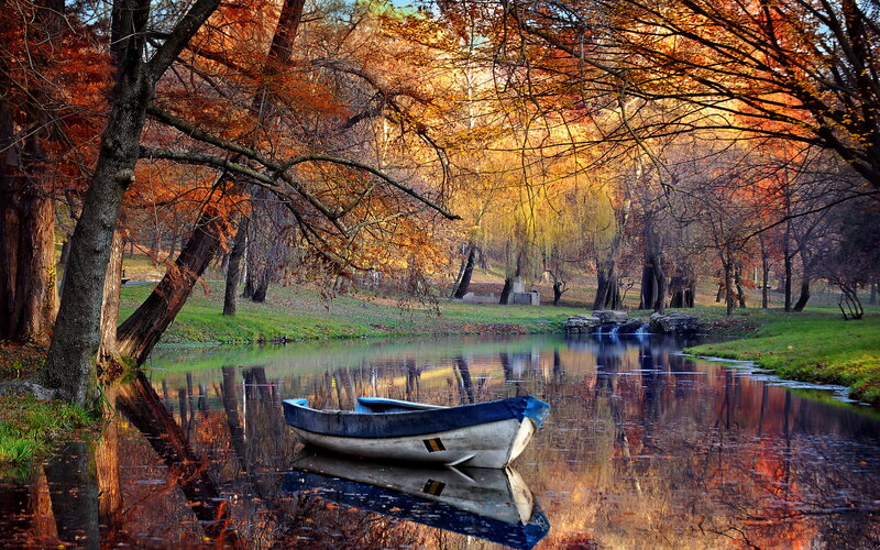 Small Boat on River — Orange, Serene