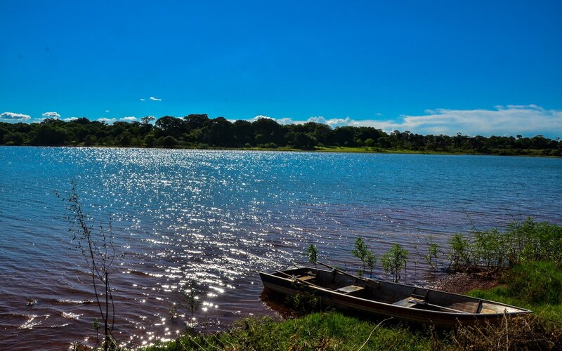 Small Boat on Riverbank — Blue, Serene