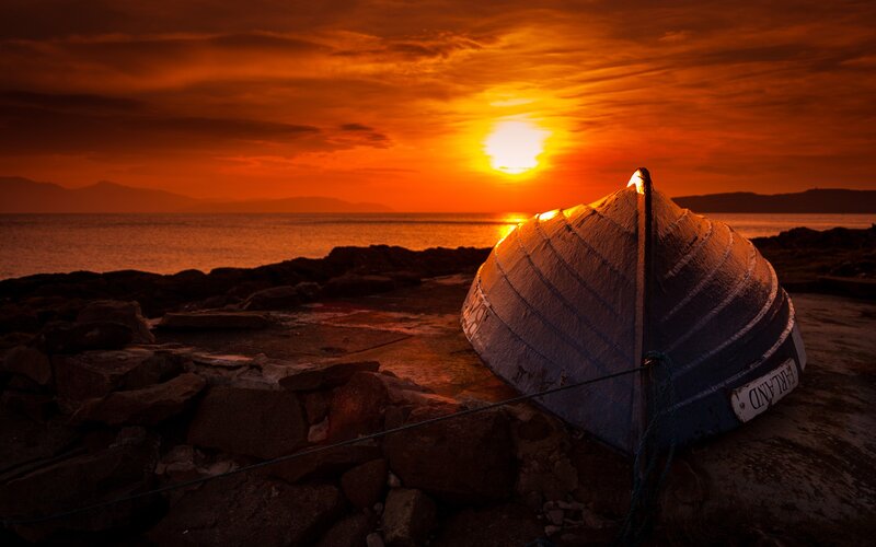 Small Boat on Rocks — Orange
