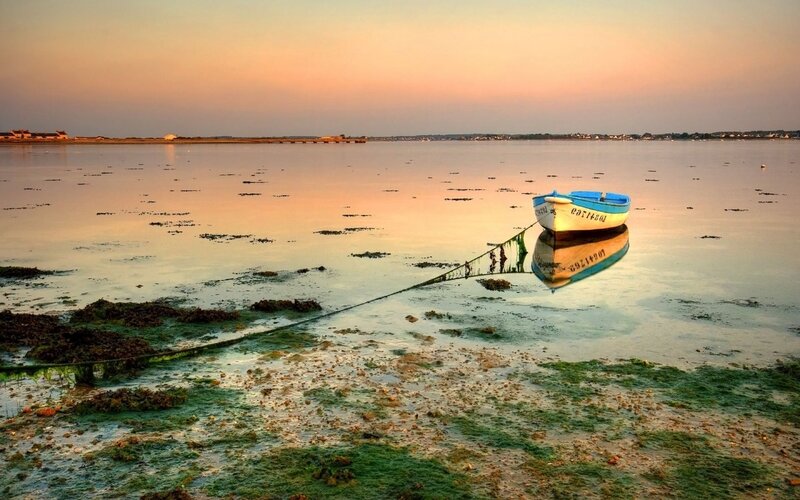 Small Boat on Tidal Flats — Orange, Serene, Sunset