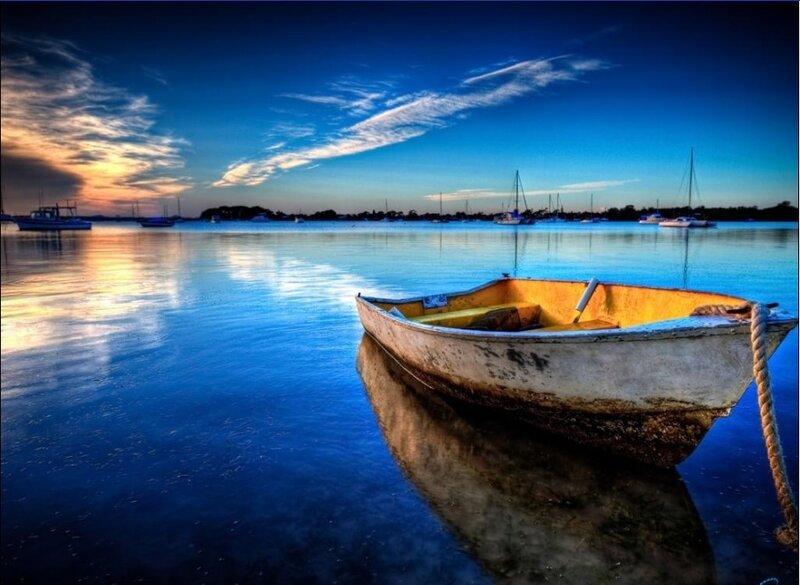 Small Boat on Water — Blue