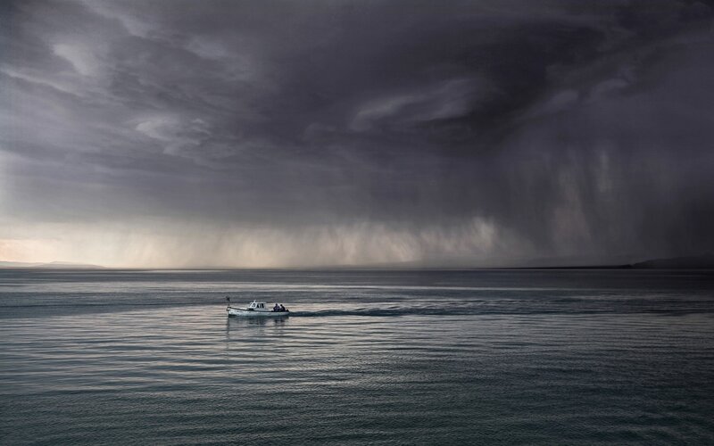 Small Boat on Water — Gray, Dramatic, Photograph