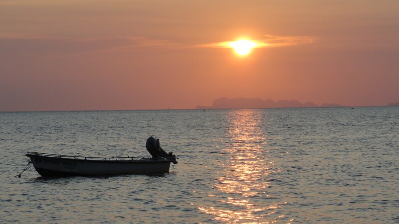 Small Boat on Water — Orange, Serene, Sunset, Photograph, Sun, Sea
