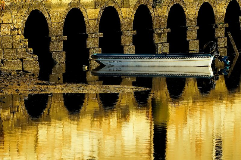 Small Boat under Arches