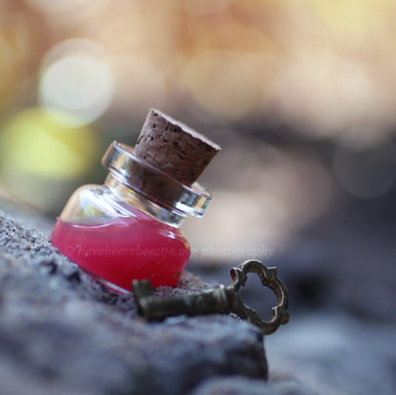Small Bottle with Red Liquid — Mysterious