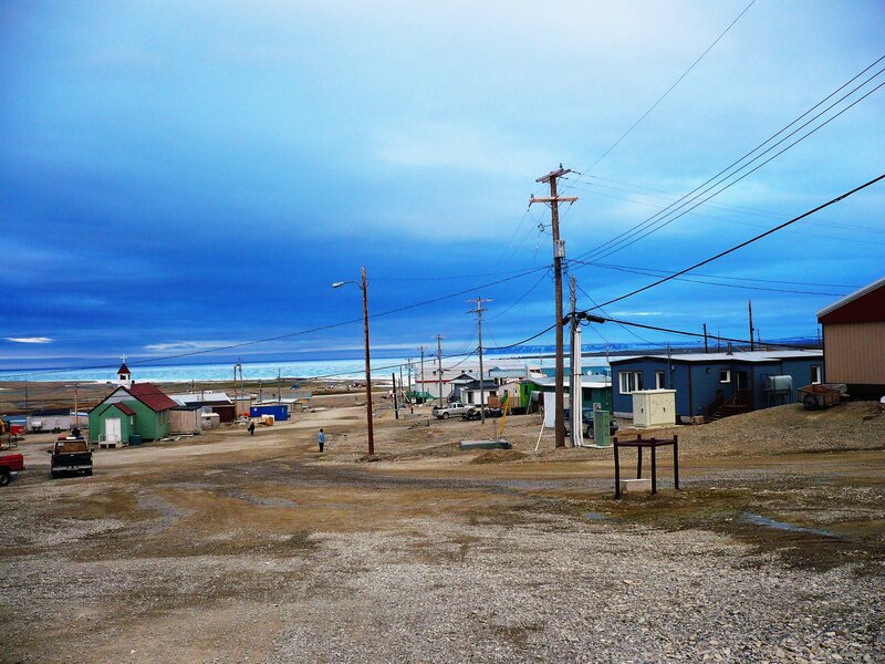 Small coastal village under blue sky