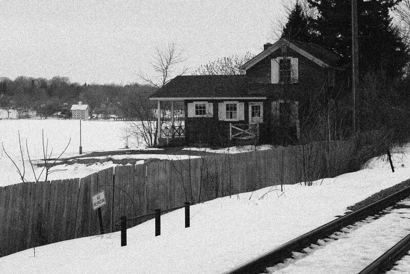 Small House by Train Tracks