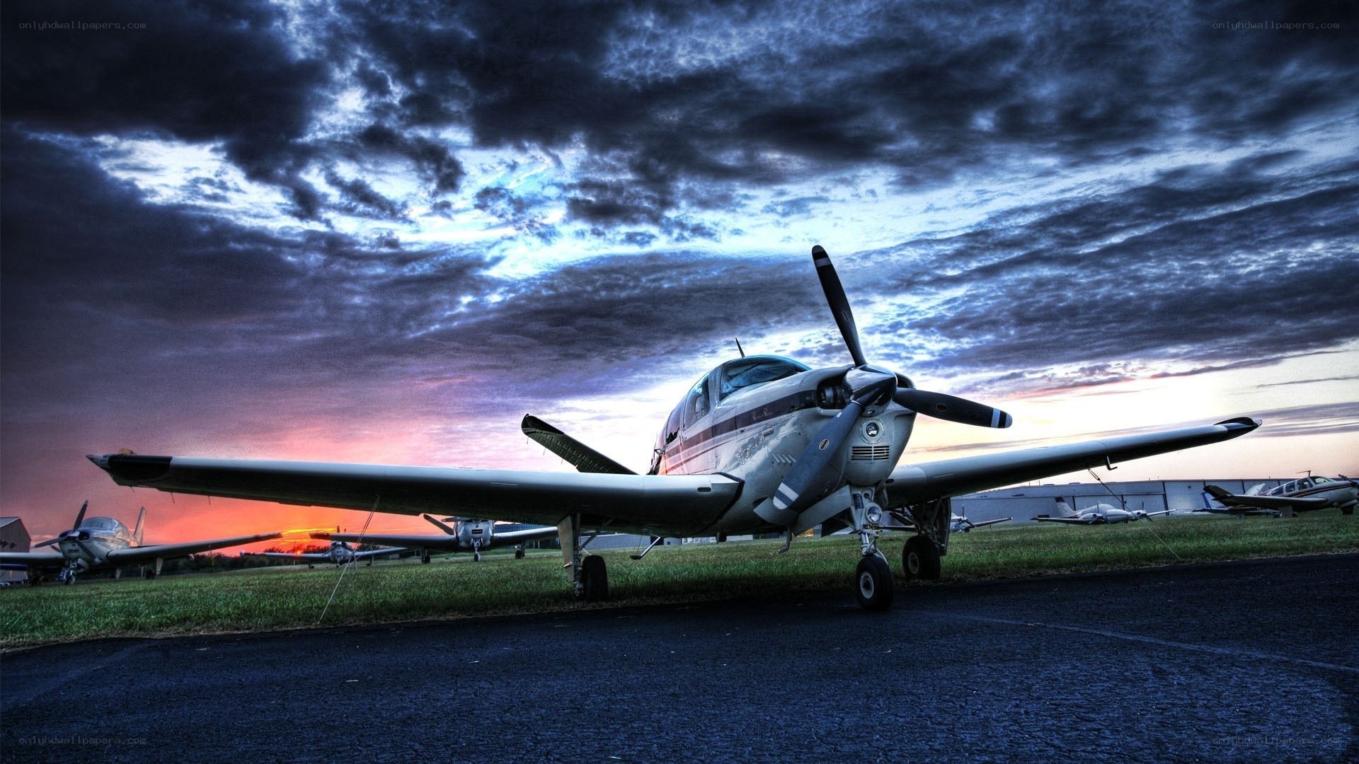 Small plane at sunset on tarmac