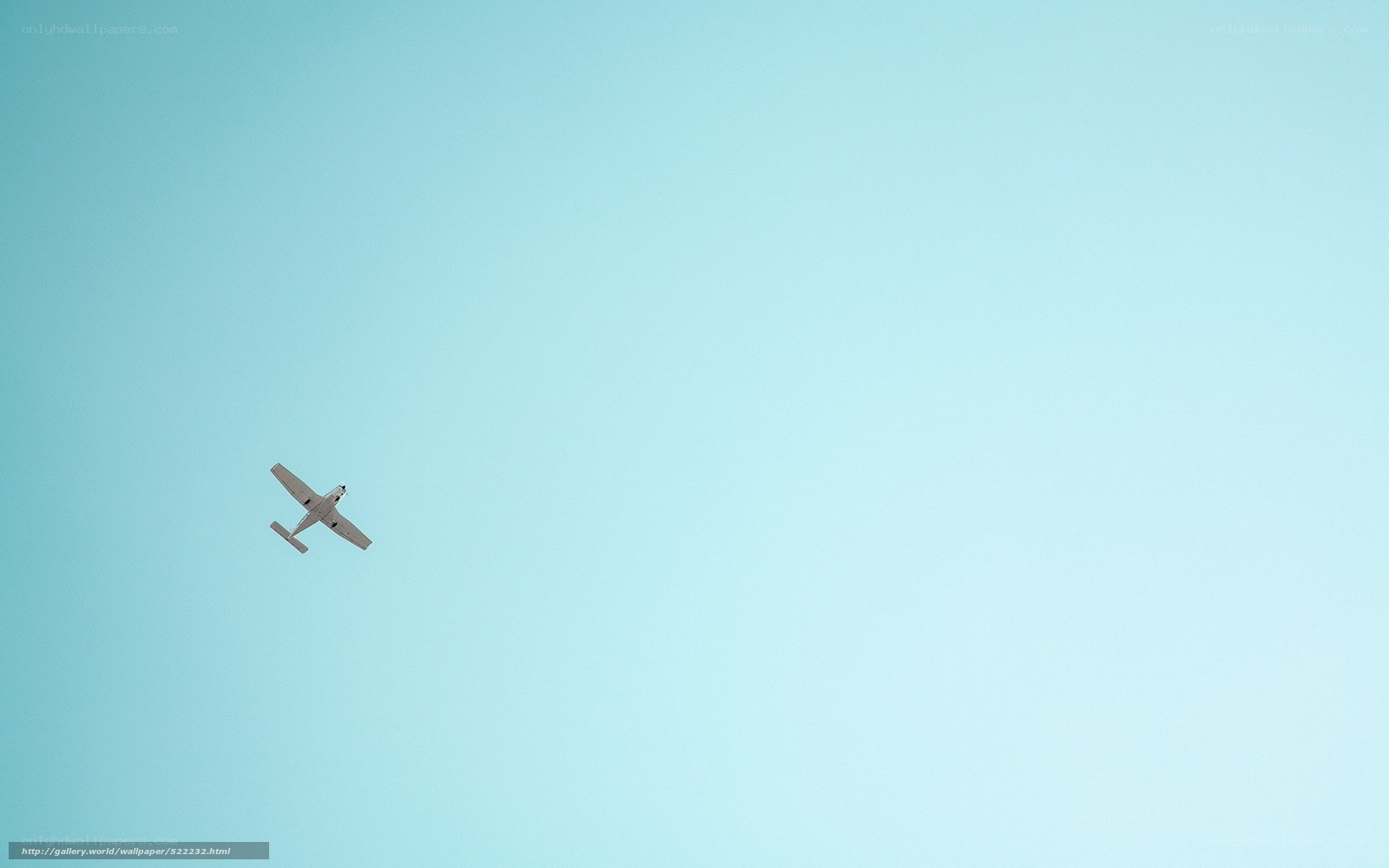 Small plane in blue sky